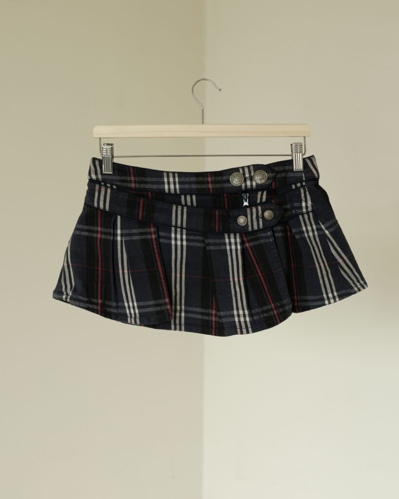 Upcycled Scottish check mini skirt with pleats and button detail.