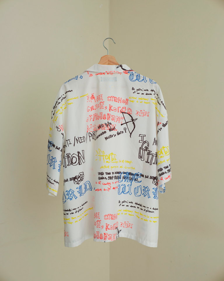 White oversized unisex shirt with multicolour graffiti-style graphic print by Now + Thenn.