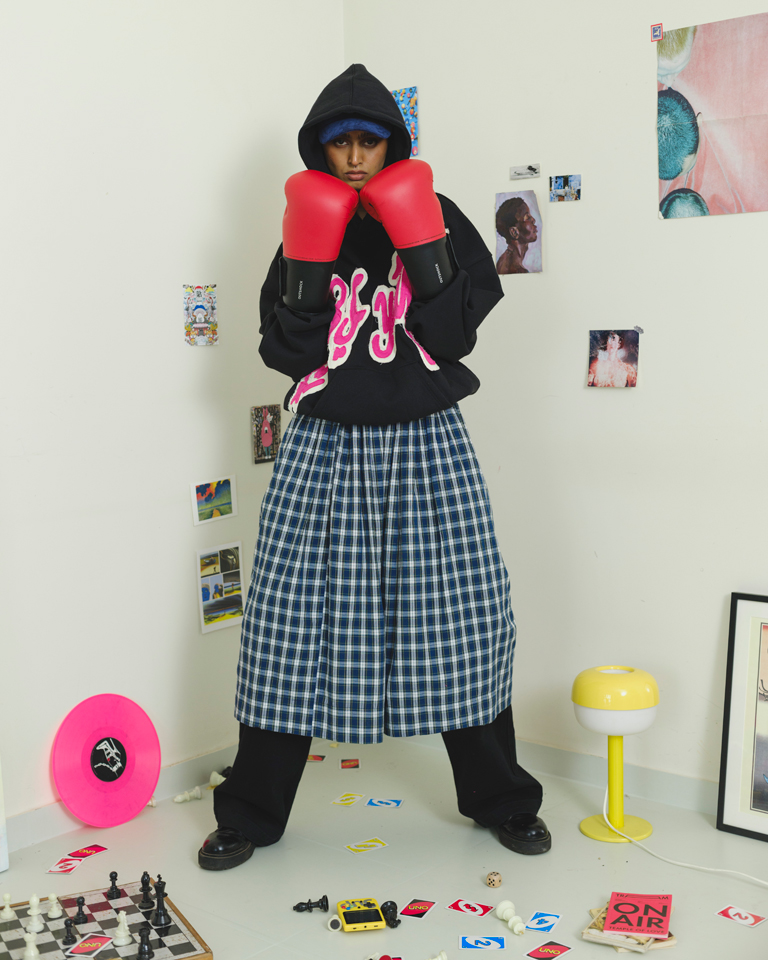 Black oversized hoodie with bold pink chenille graffiti patch and relaxed fit from Now + Thenn.