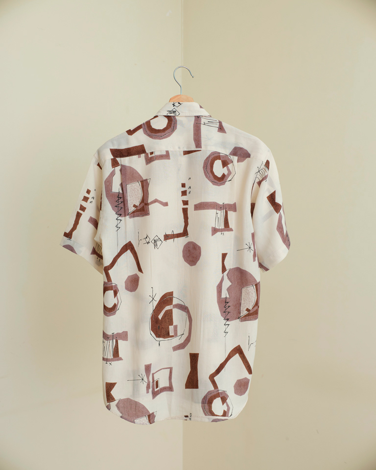 Abstract print cream and brown short sleeve shirt with relaxed fit, styled casually for everyday wear