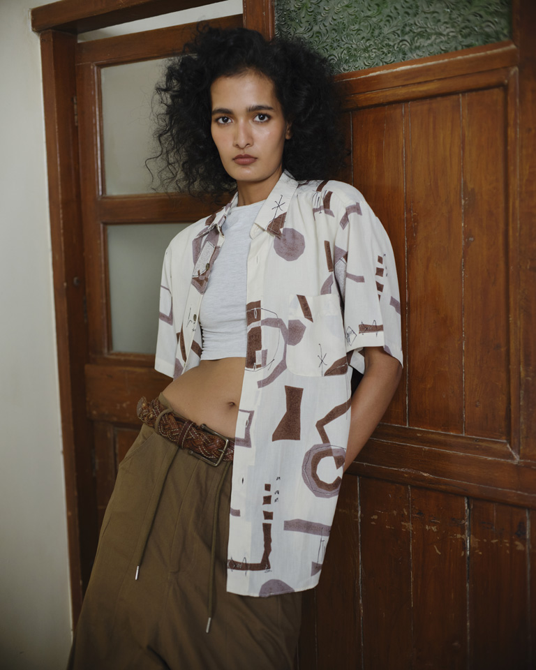 Abstract print cream and brown short sleeve shirt with relaxed fit, styled casually for everyday wear