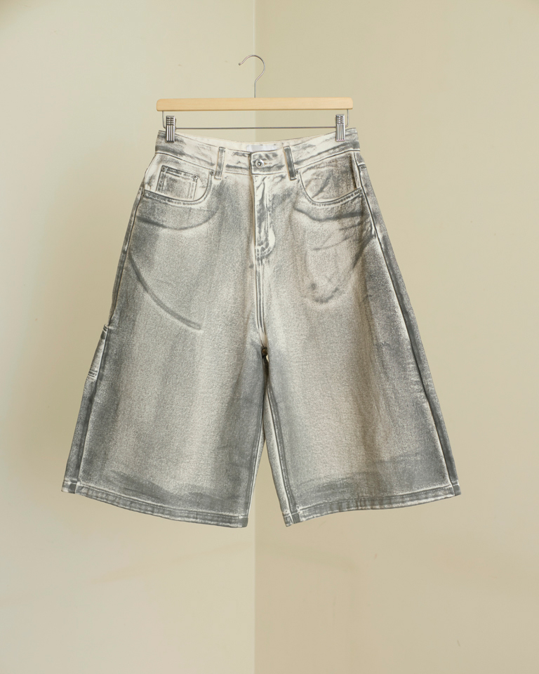 Unisex light gray washed denim carpenter shorts with knee-length wide legs, slanted pockets, and dragon embroidery on the back pocket