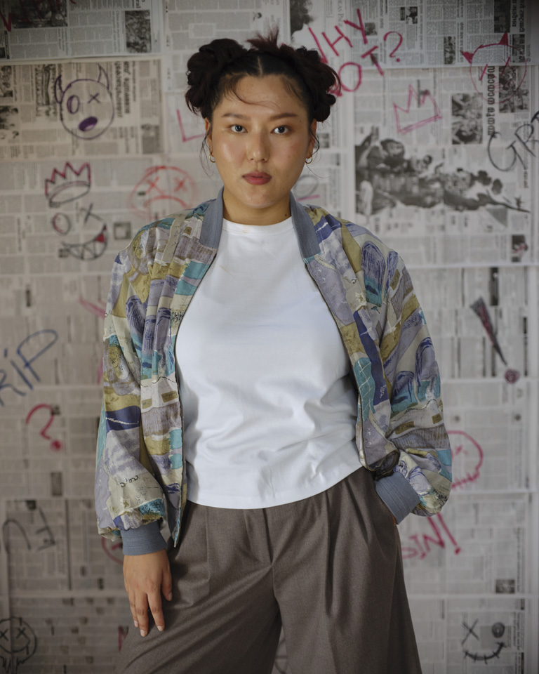 A one-of-a-kind vintage bomber jacket featuring an abstract all-over print in muted earthy tones. Relaxed unisex fit with ribbed cuffs and hem. Curated consciously by Now + Thenn.