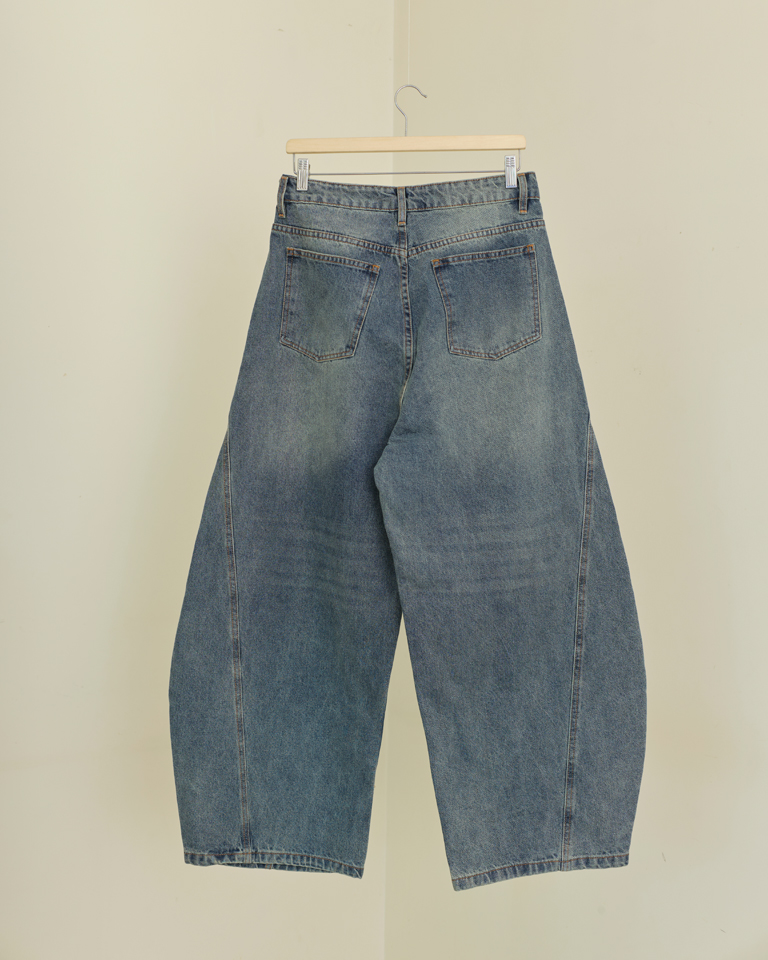 Vintage oversized bubble wide-leg denim jeans with curved panels and relaxed silhouette by Now Thenn