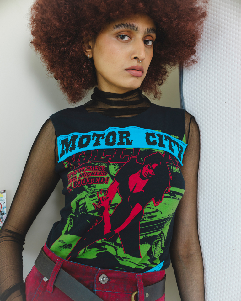 Black sleeveless graphic top with Motor City Hell Cats print and retro artwork, fitted silhouette by Now + Thenn.