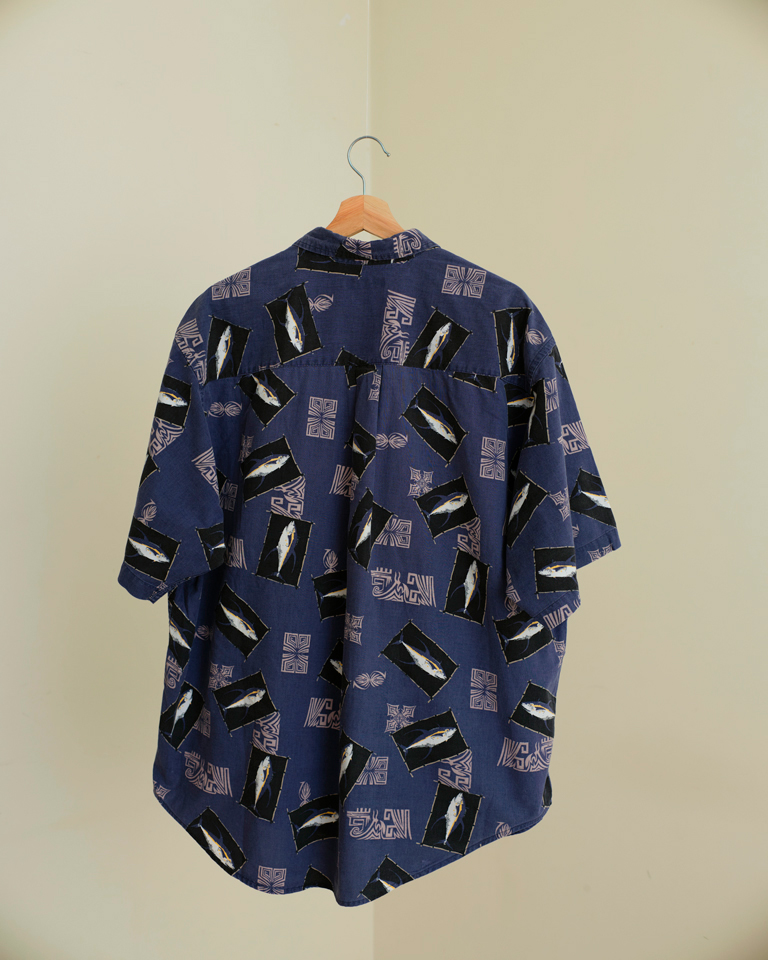 Blue graphic shirt with tuna-inspired motifs and geometric pattern shown back