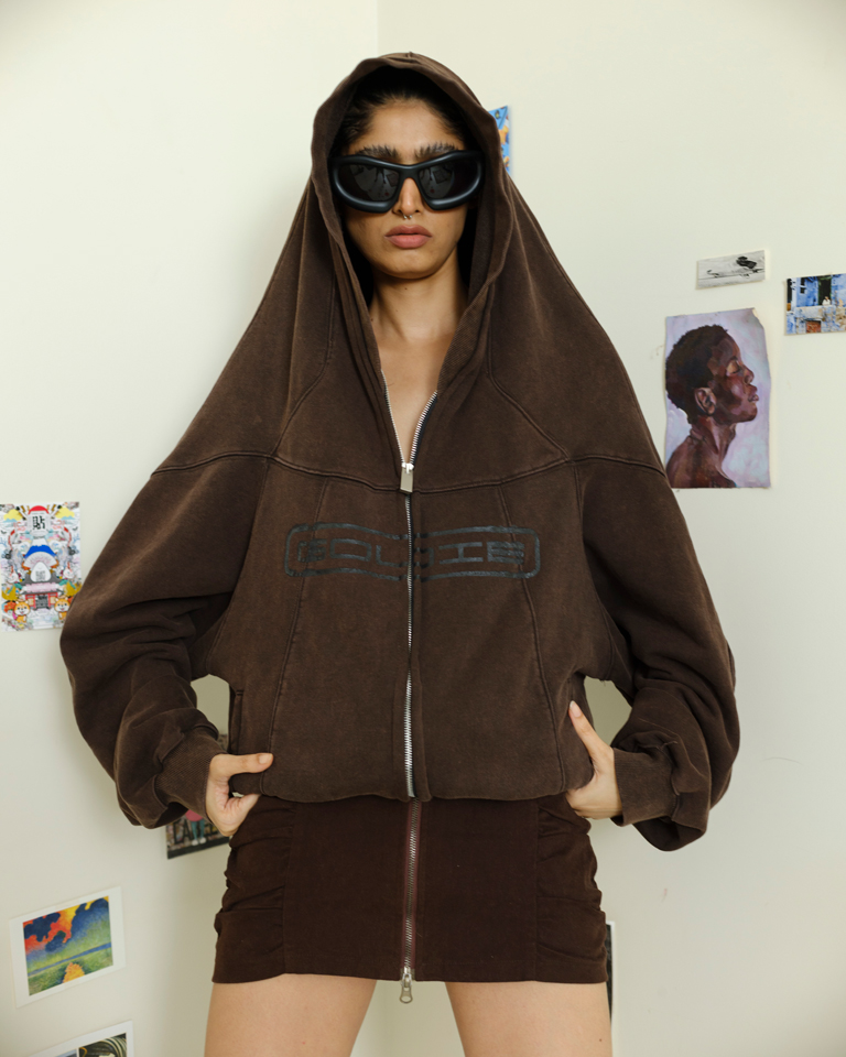 Oversized brown hoodie with sculpted hood, exaggerated shoulder detail and two-way zipper, modern streetwear design by Now + Thenn.
