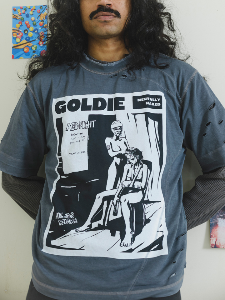 Grey oversized distressed graphic t-shirt with punk text print and front illustration, streetwear style by Now + Thenn.