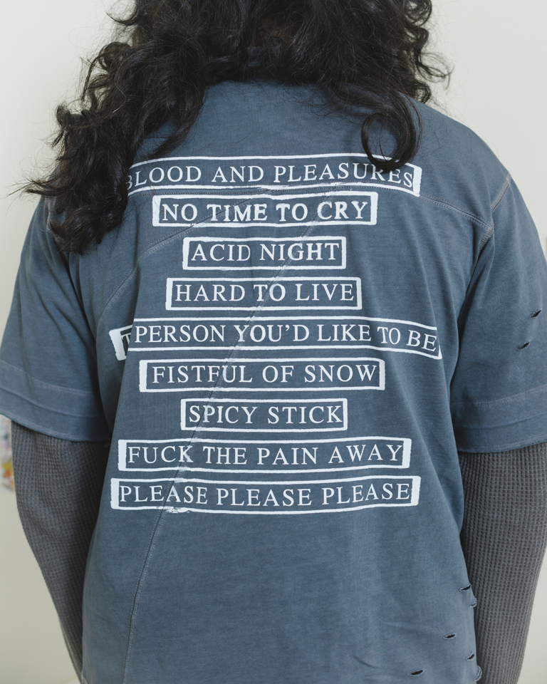 Grey oversized distressed graphic t-shirt with punk text print and front illustration, streetwear style by Now + Thenn.