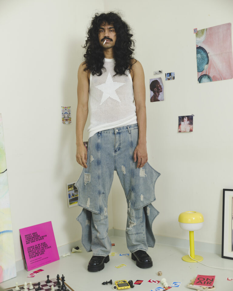 Light wash wing panel distressed denim jeans with sculptural side extensions and wide-leg fit by Now + Thenn.