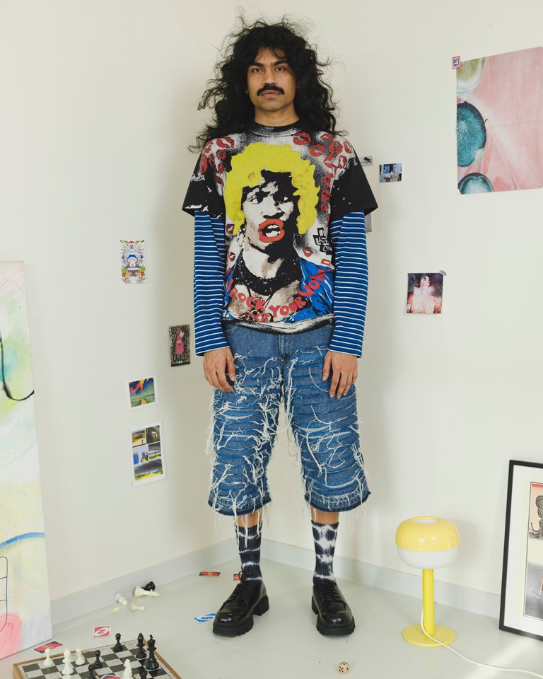 Upcycled shredded denim jorts featuring distressed horizontal panel detailing, exposed frayed threads and a relaxed oversized fit crafted from reclaimed denim.