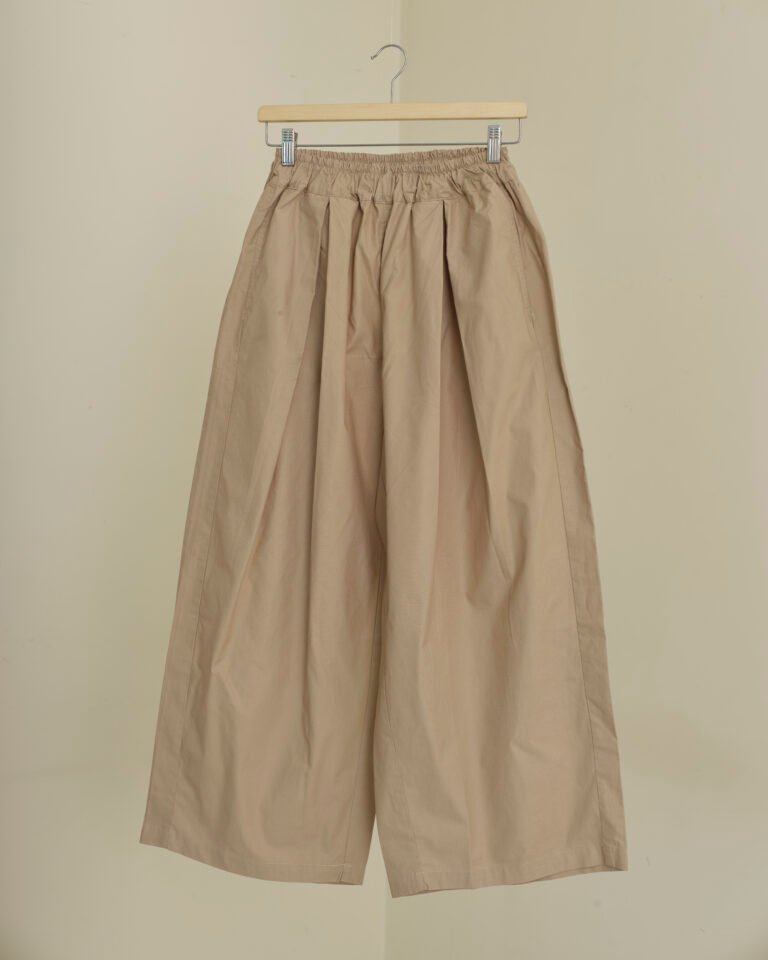 Beige wide-leg trousers with gathered elasticated waistband and front pleats