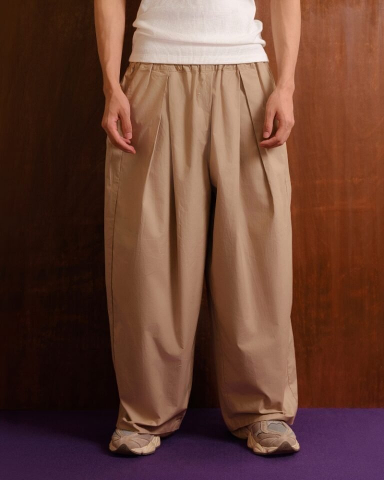 Beige wide-leg trousers with gathered elasticated waistband and front pleats