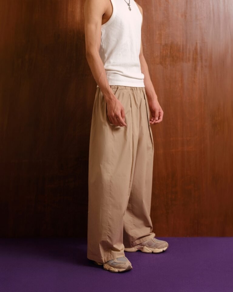 Beige wide-leg trousers with gathered elasticated waistband and front pleats
