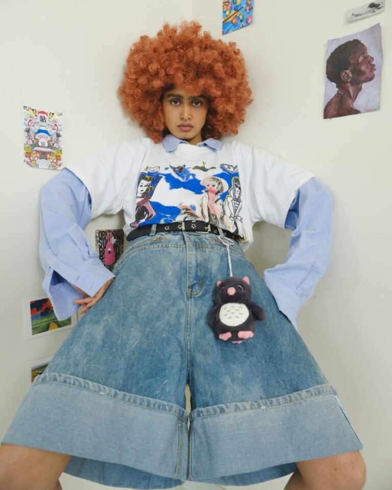 Wide-leg blue denim jorts with oversized folded hem and zip pockets