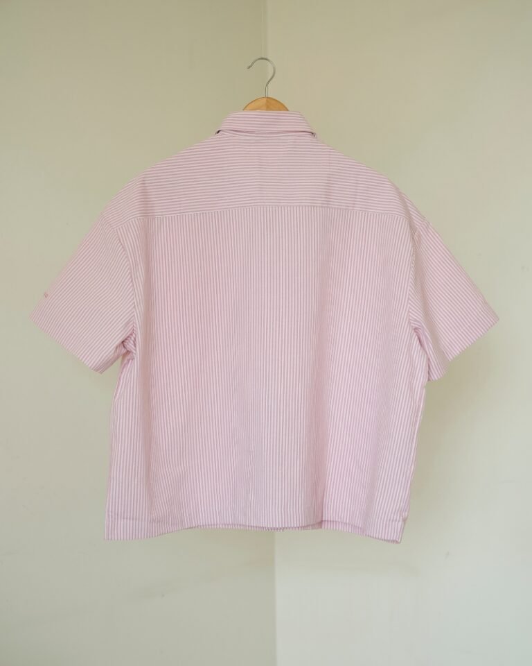 Pink and white striped shirt.