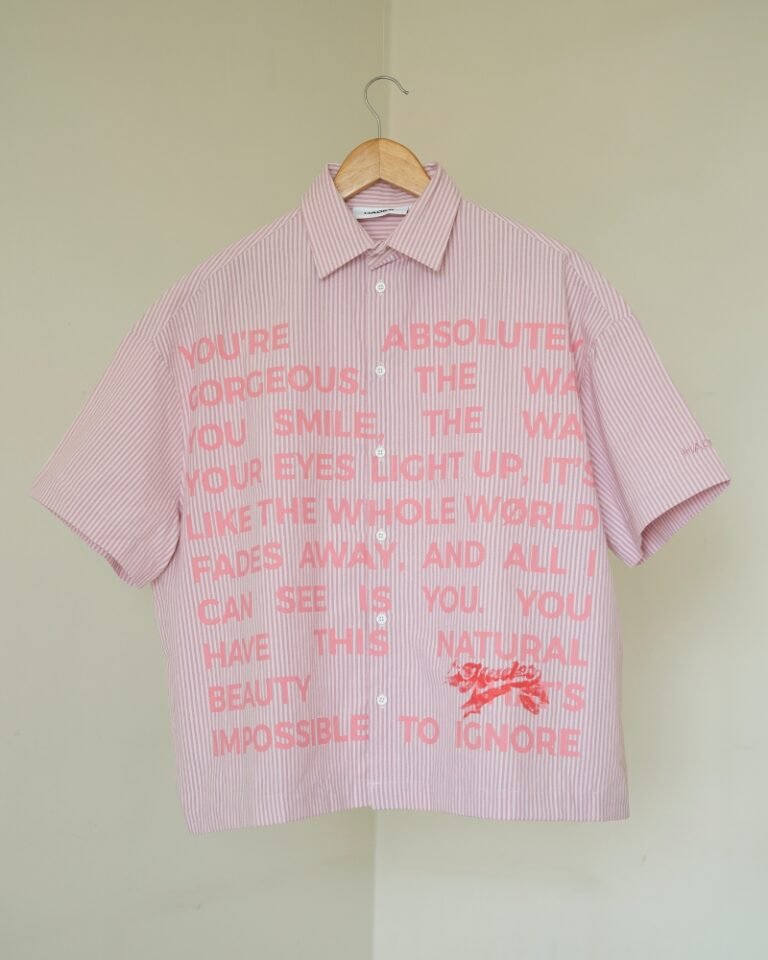 Pink and white striped shirt with an allover pink love-note text print.