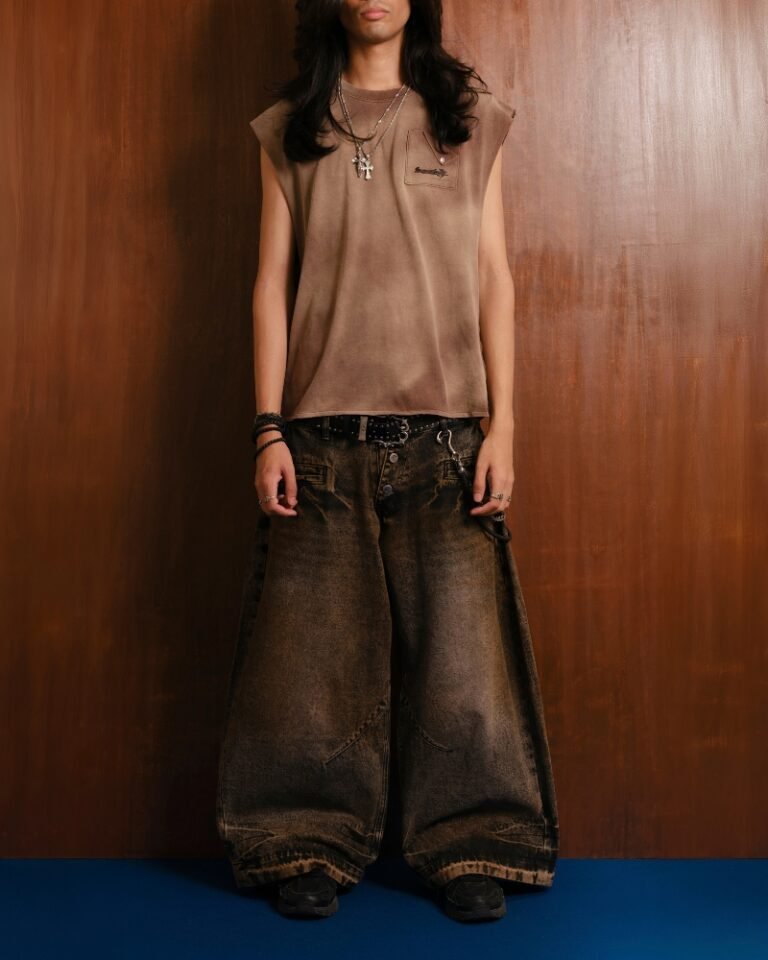 Brown and black acid mud-wash wide-leg jeans with a layered double waistband and double back pockets, shown on a hanger front and back.