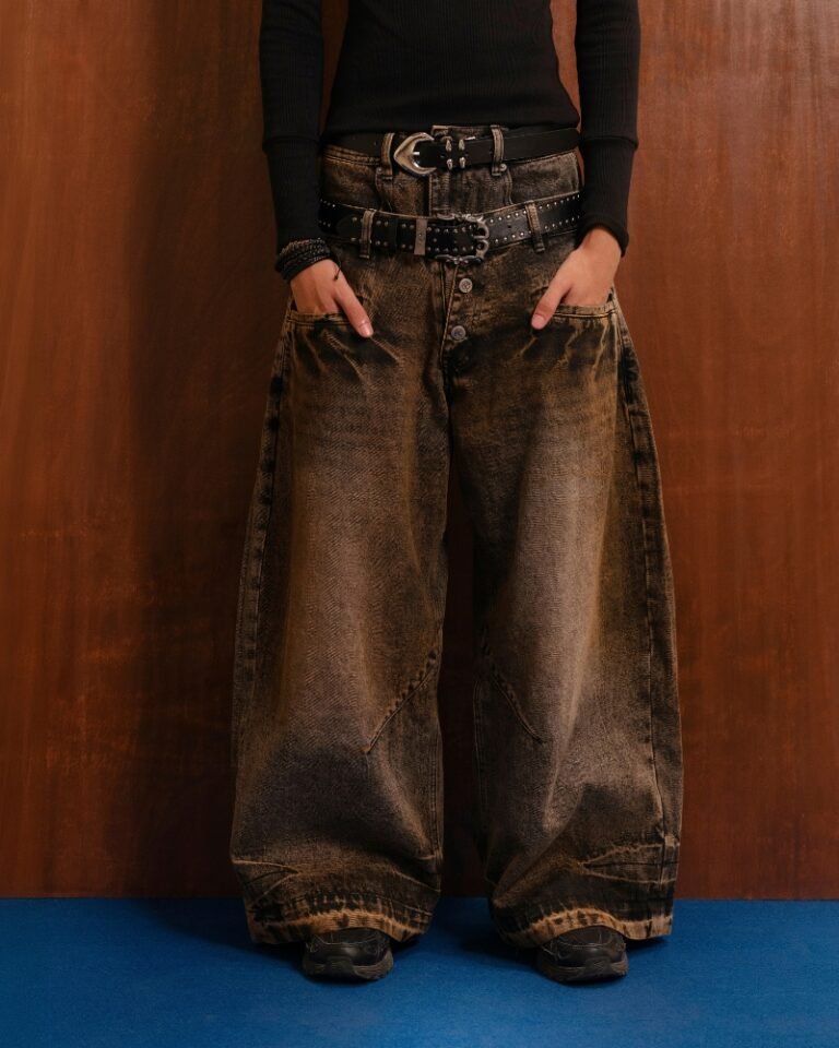 Brown and black acid mud-wash wide-leg jeans with a layered double waistband and double back pockets, shown on a hanger front and back.