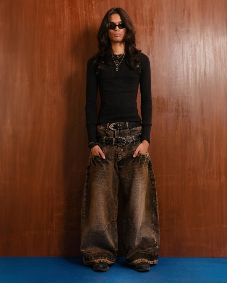 Brown and black acid mud-wash wide-leg jeans with a layered double waistband and double back pockets, shown on a hanger front and back.